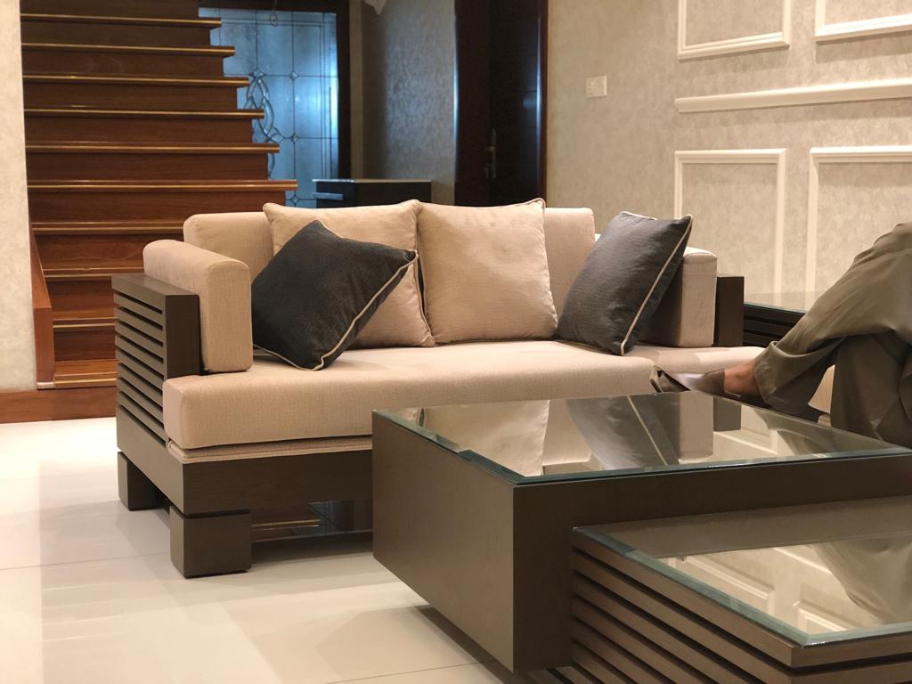 Modern dining room with sofa and wooden accents